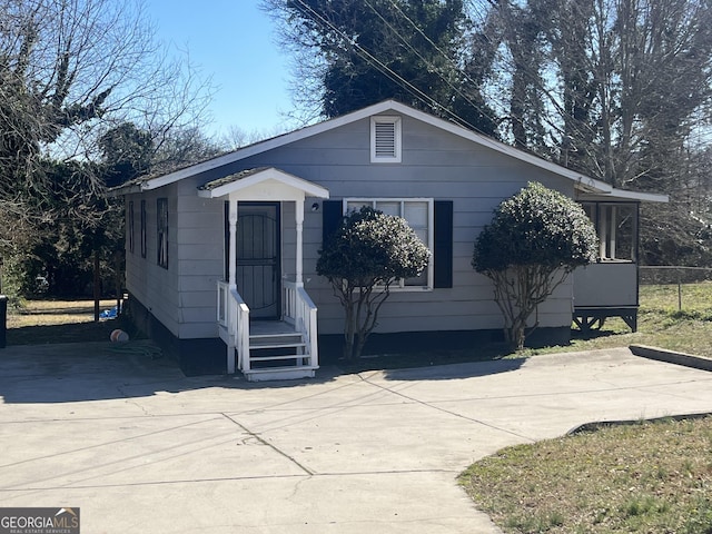 view of front of property with concrete driveway