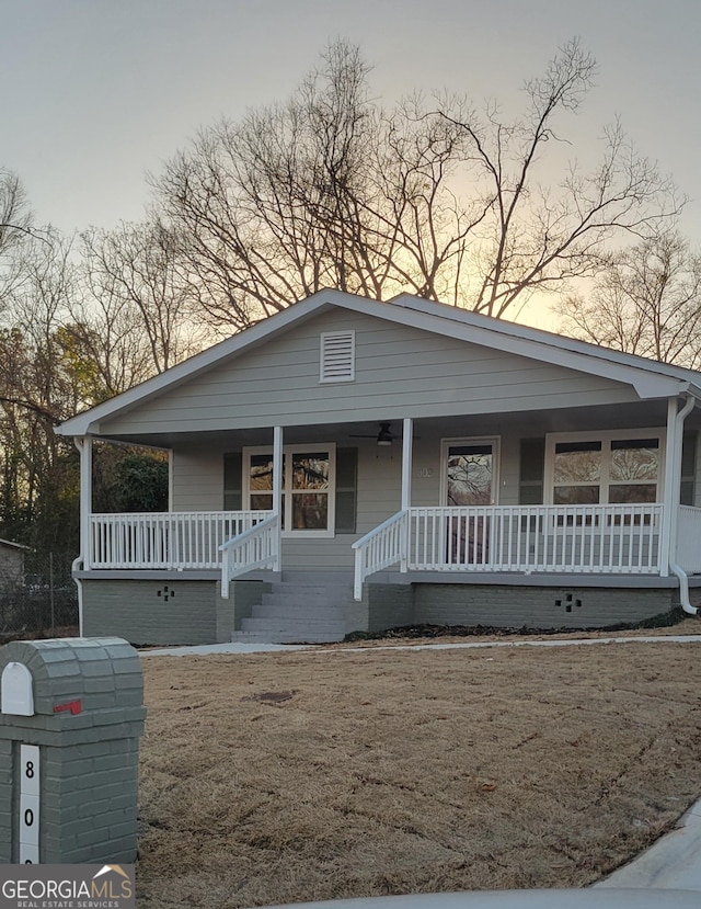 view of front of home featuring a porch and a front lawn