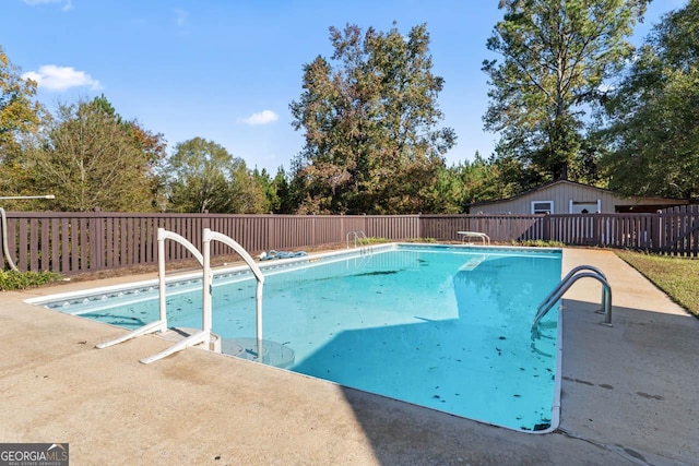 view of swimming pool featuring fence and a fenced in pool