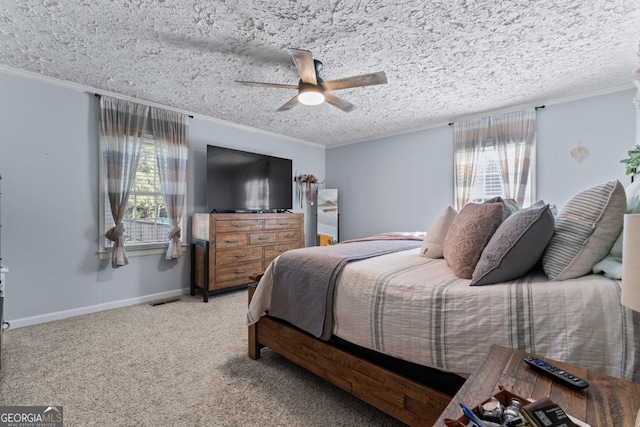 bedroom with light carpet, baseboards, ceiling fan, a textured ceiling, and crown molding