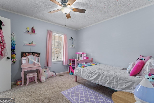 bedroom featuring a textured ceiling, carpet flooring, a ceiling fan, baseboards, and crown molding