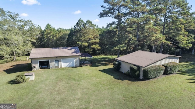 birds eye view of property featuring a view of trees