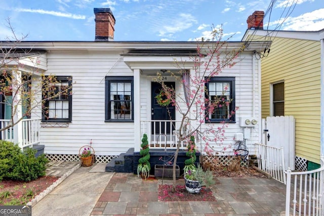 exterior space featuring a chimney