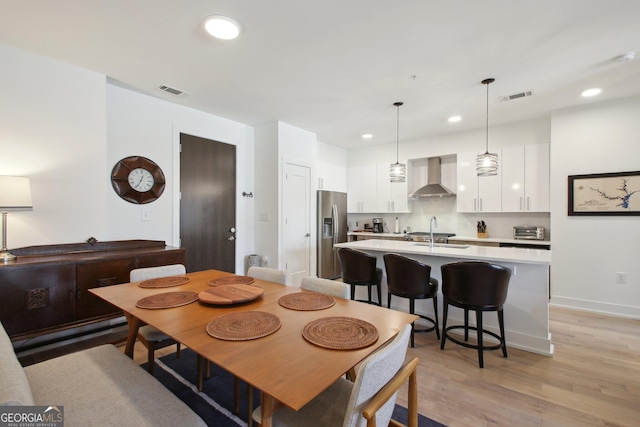 775 Juniper St NE Unit 613, Atlanta, GA 30308 - dining space featuring recessed lighting and light wood-style flooring