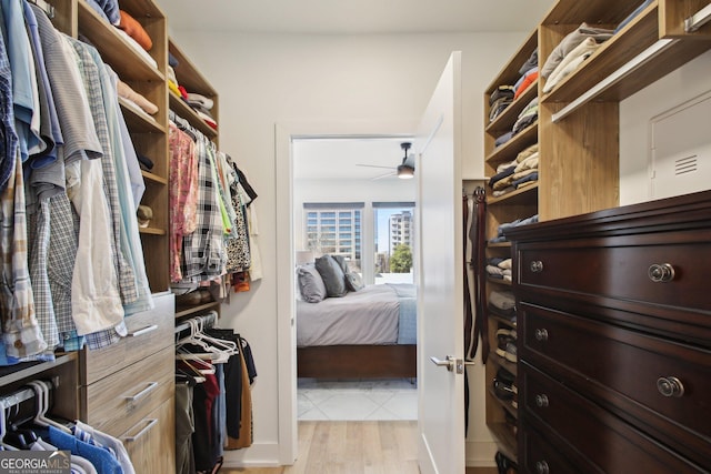 775 Juniper St NE Unit 613, Atlanta, GA 30308 - spacious closet with ceiling fan and light wood-style flooring