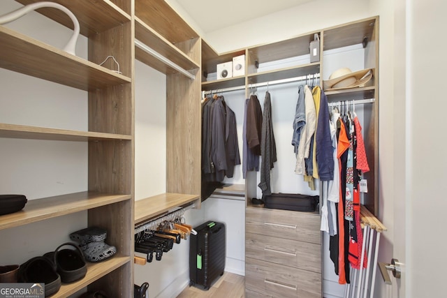 775 Juniper St NE Unit 613, Atlanta, GA 30308 - walk in closet with wood finished floors