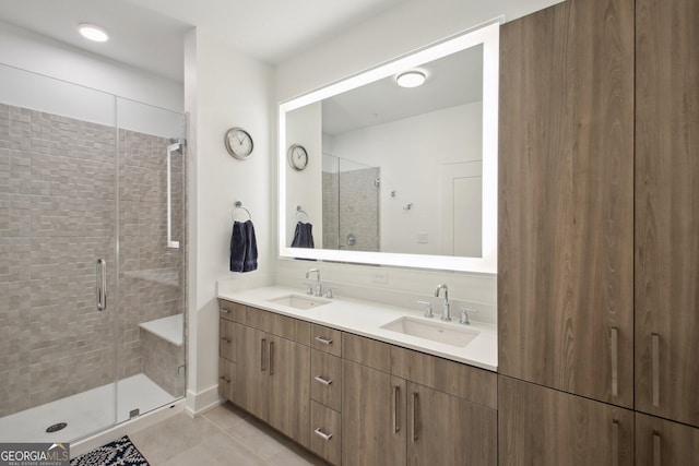 775 Juniper St NE Unit 613, Atlanta, GA 30308 - bathroom with double vanity, a shower stall, and tile patterned flooring