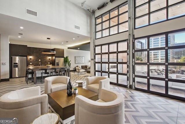 775 Juniper St NE Unit 613, Atlanta, GA 30308 - common area featuring a towering ceiling and recessed lighting