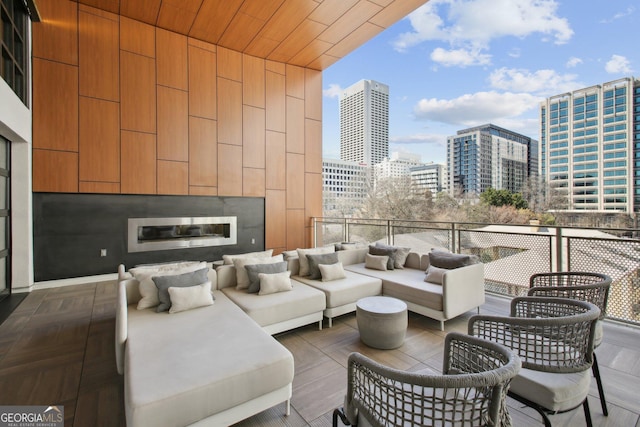 775 Juniper St NE Unit 613, Atlanta, GA 30308 - view of patio / terrace with a city view and an outdoor living space with a fireplace
