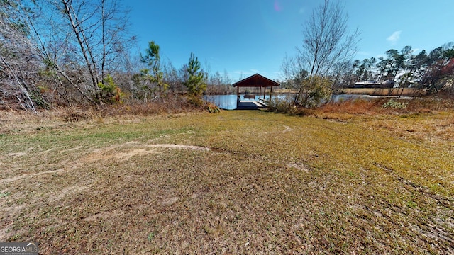 view of yard featuring a water view and a gazebo