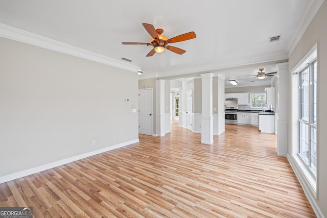 unfurnished living room featuring ornate columns, visible vents, and light wood-style floors