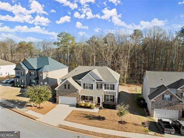 view of front of property with a garage and concrete driveway