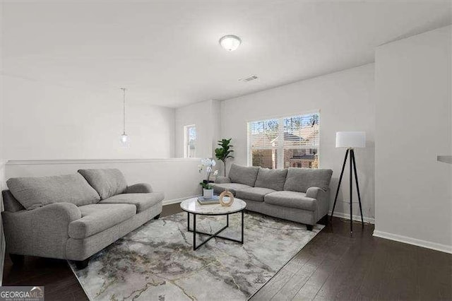 living room with wood finished floors and baseboards