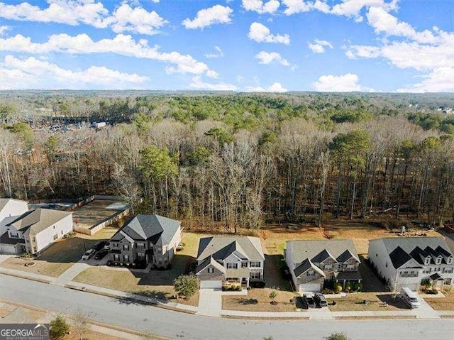 aerial view with a residential view and a view of trees