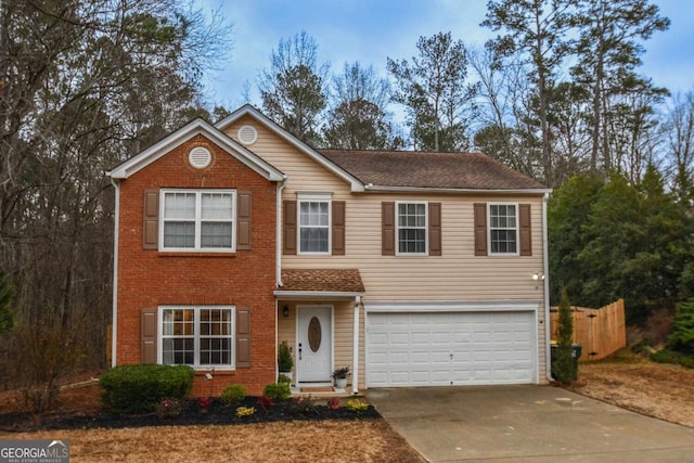 view of front of house featuring a garage, brick siding, driveway, and fence