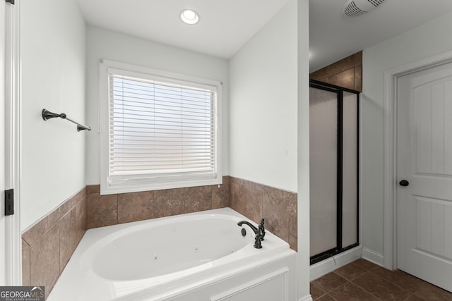 bathroom featuring a stall shower, tile patterned flooring, a garden tub, and visible vents