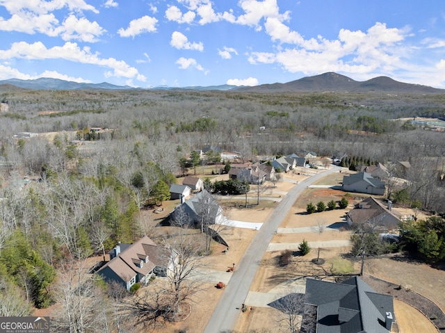 drone / aerial view featuring a residential view and a mountain view