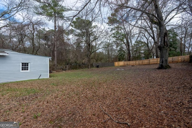 view of yard with a fenced backyard