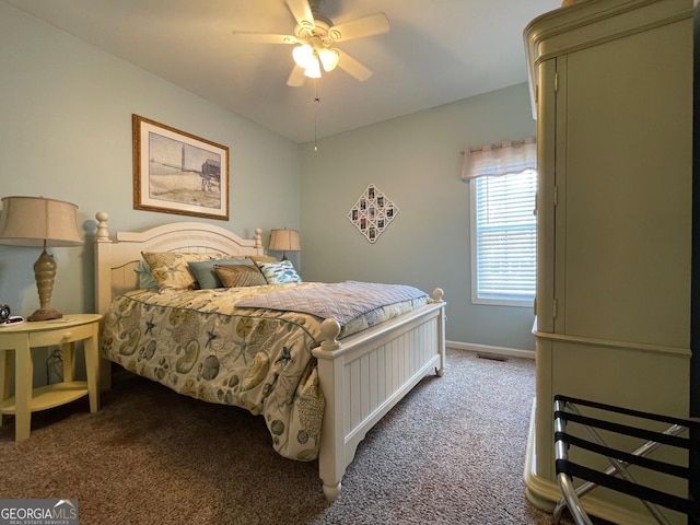 carpeted bedroom featuring visible vents, baseboards, and ceiling fan