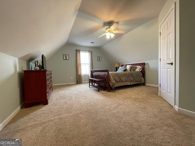 bedroom with lofted ceiling, light colored carpet, ceiling fan, and baseboards