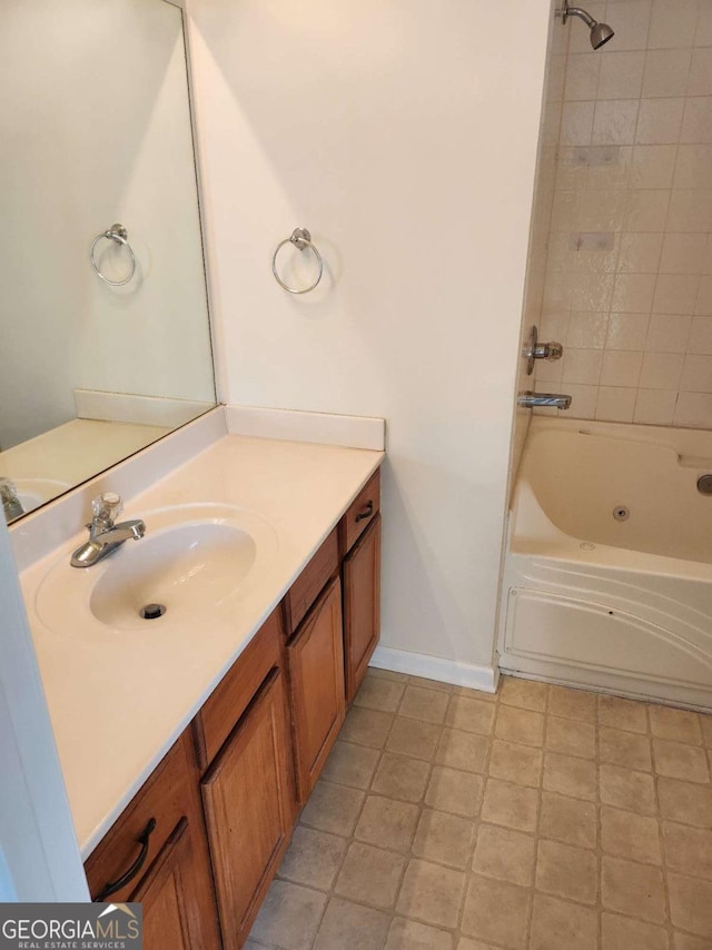 full bath featuring baseboards, vanity, and shower / tub combination