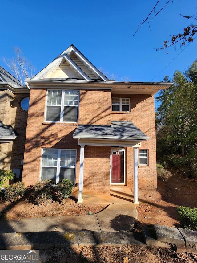 traditional-style house with brick siding