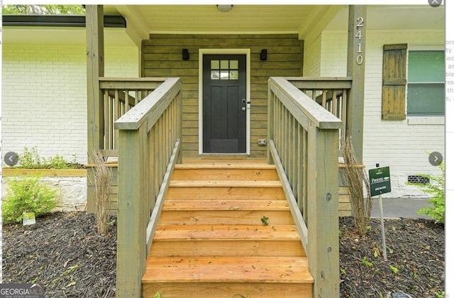 entrance to property with brick siding