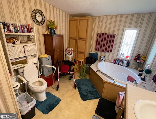 bathroom featuring toilet, vanity, a bath, tile patterned floors, and wallpapered walls