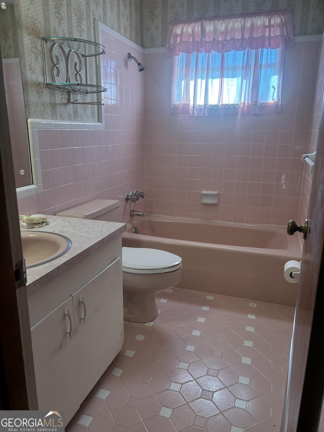 full bath with toilet, shower / bathing tub combination, tile patterned flooring, and vanity