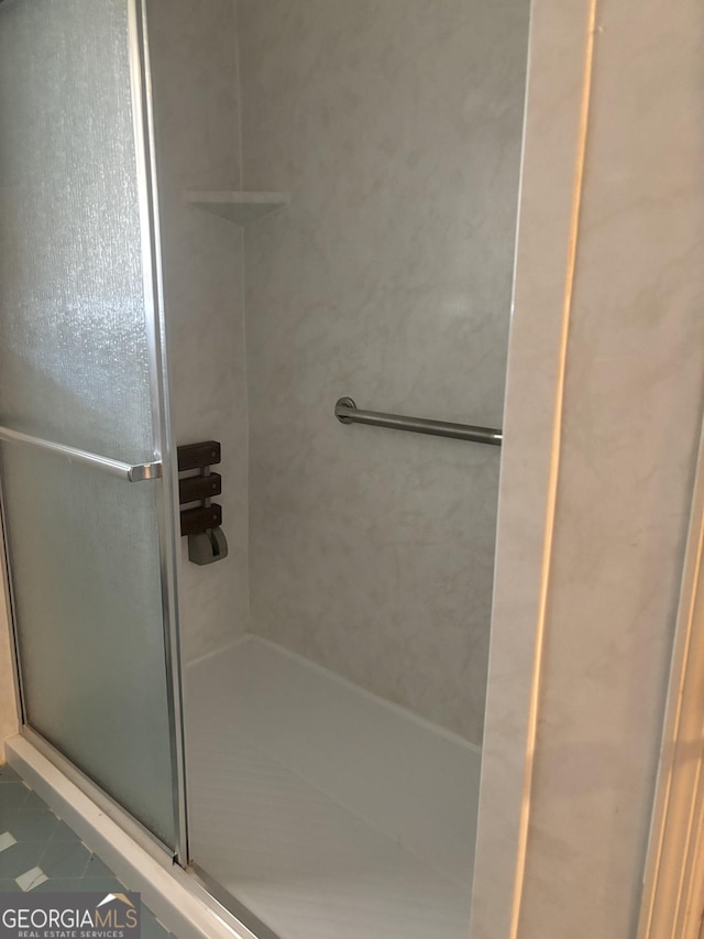 bathroom featuring a stall shower