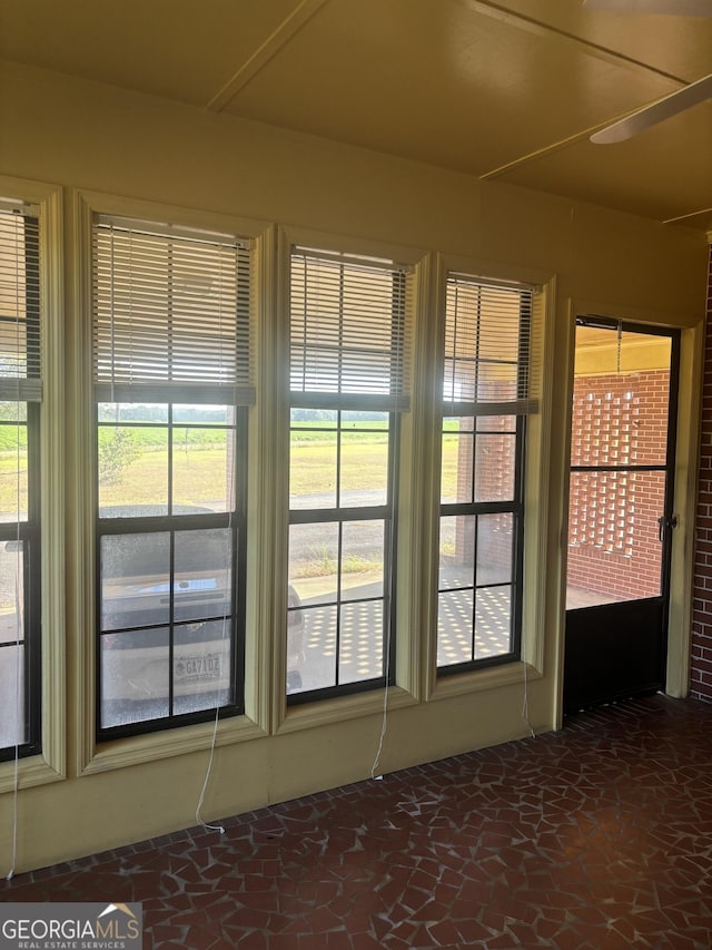 unfurnished sunroom with a healthy amount of sunlight