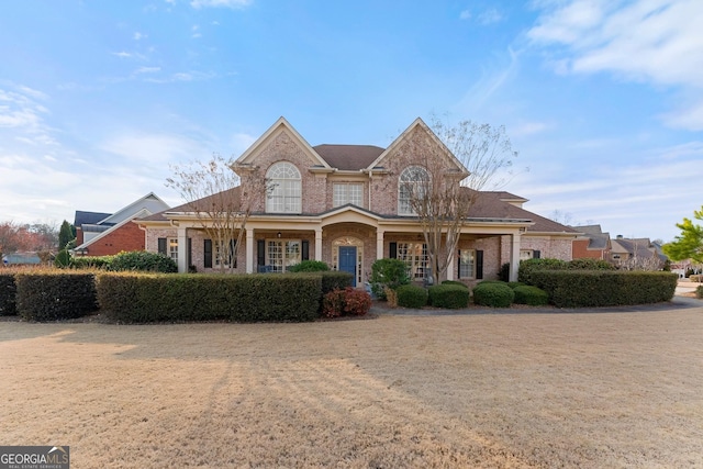 view of front of home featuring brick siding