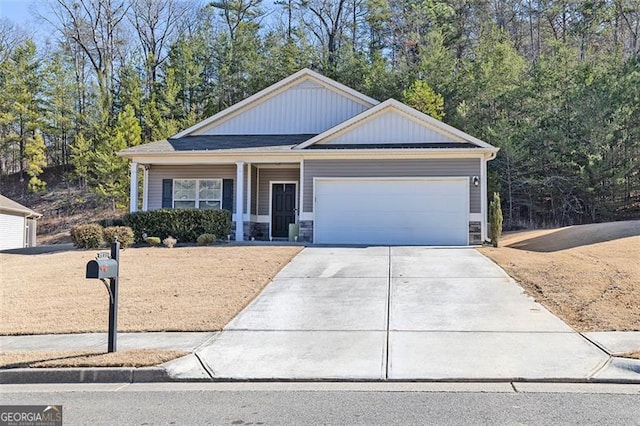 view of front facade featuring concrete driveway, board and batten siding, and an attached garage