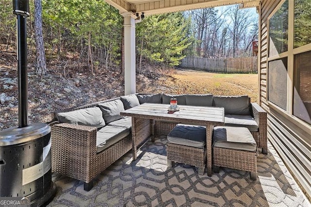 view of patio / terrace featuring fence