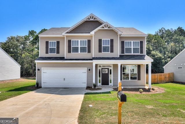 view of front of property featuring driveway, a front yard, and fence