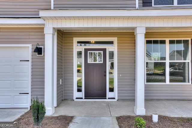 property entrance with a garage