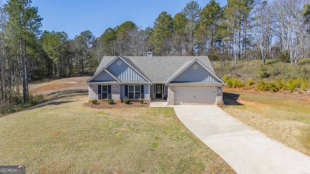 view of front of home with a garage, concrete driveway, a front lawn, board and batten siding, and brick siding