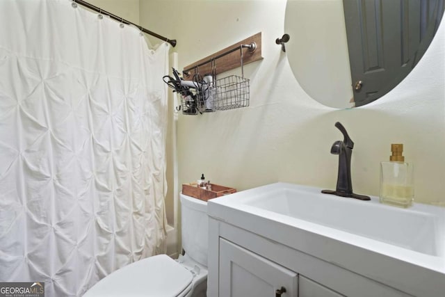 full bathroom featuring vanity, shower / bath combination with curtain, and toilet