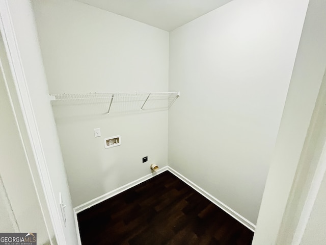 laundry room with hookup for a washing machine, hookup for an electric dryer, wood finished floors, laundry area, and baseboards