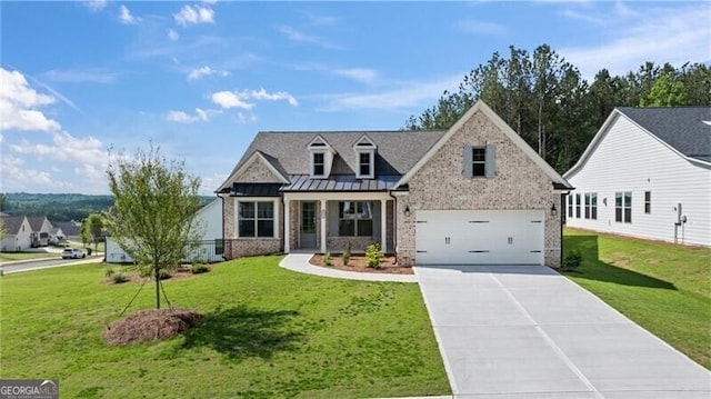 view of front facade featuring a garage, concrete driveway, metal roof, a standing seam roof, and a front lawn