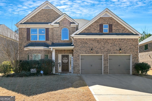 view of front of property with driveway, brick siding, and an attached garage