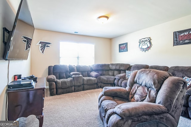 living area featuring visible vents and carpet flooring