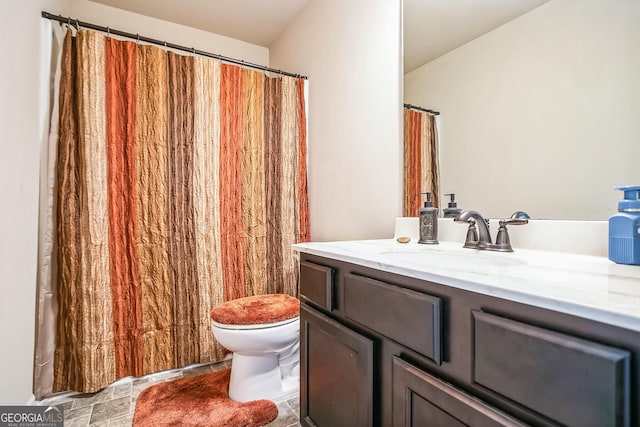 full bath featuring toilet and vanity