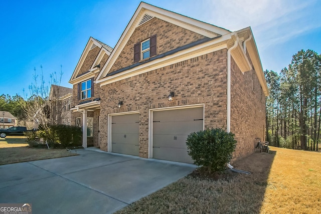 view of home's exterior featuring a garage, concrete driveway, brick siding, and a lawn