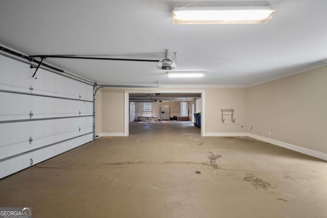 garage with baseboards and a garage door opener