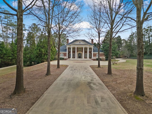 view of home's community featuring driveway