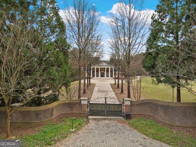 exterior space featuring a gate and fence