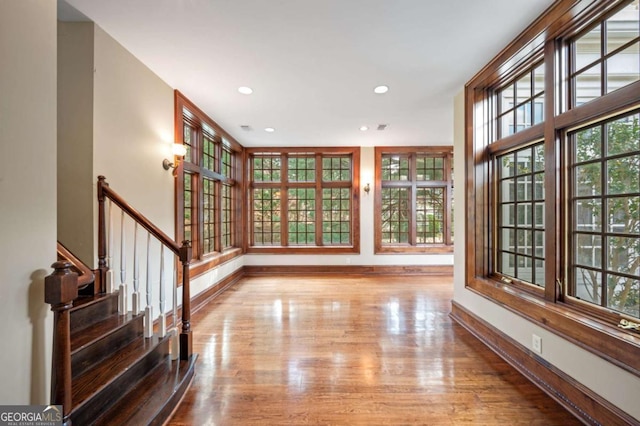 interior space with light wood finished floors, baseboards, and recessed lighting