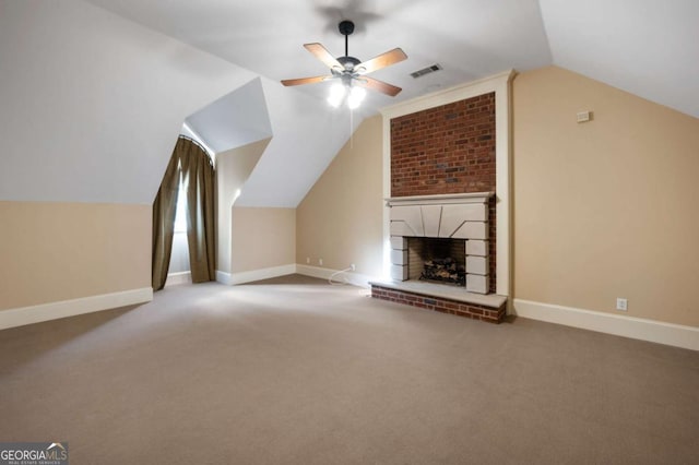 bonus room with a fireplace, lofted ceiling, visible vents, carpet flooring, and baseboards