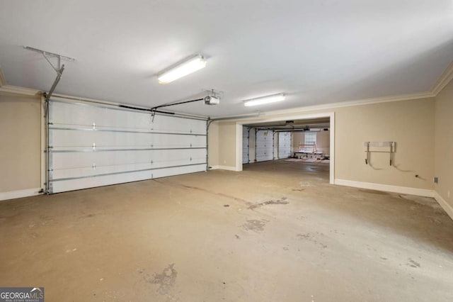 garage featuring baseboards and a garage door opener